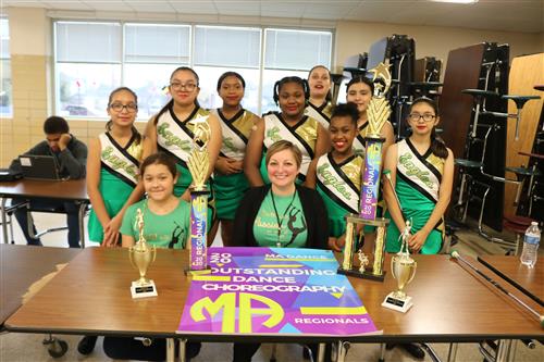 Twirlers pose with Coach Weeks 